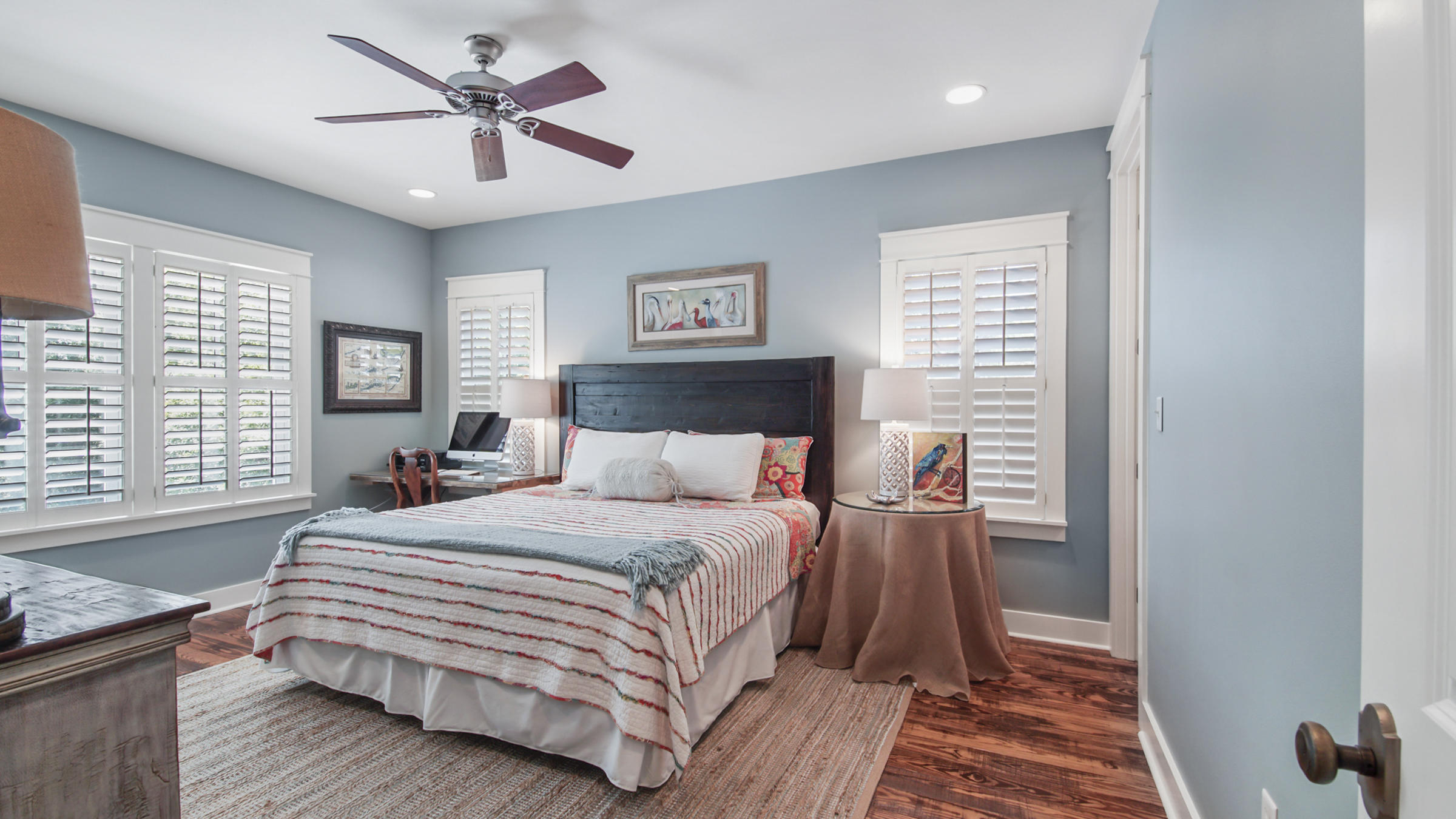 247 Artesian Way Watersound, FL 32461 - Photo 25 of 36 a bedroom with a bed and a chandelier