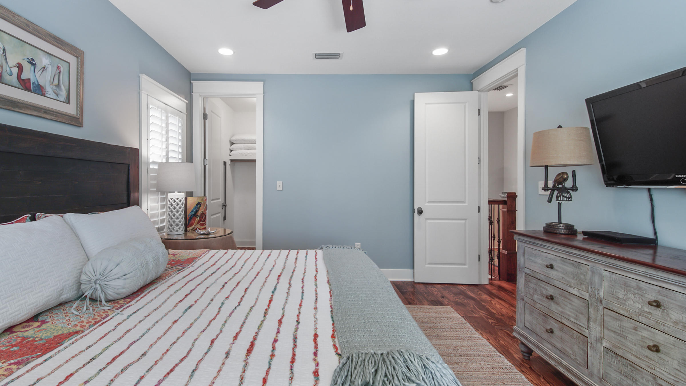 247 Artesian Way Watersound, FL 32461 - Photo 26 of 36 a bedroom with a bed and flat screen tv