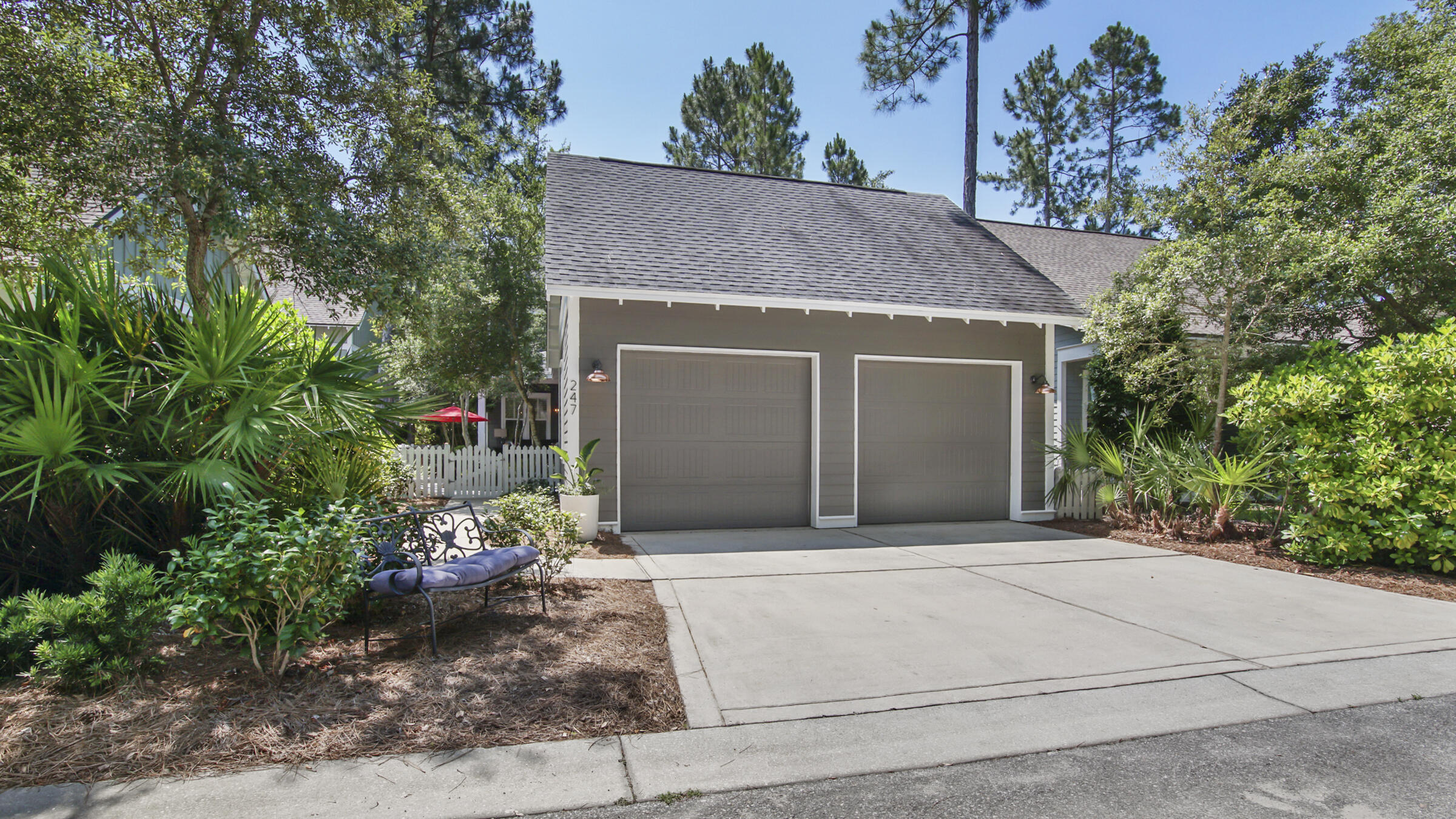 247 Artesian Way Watersound, FL 32461 - Photo 35 of 36 a front view of a house with a garden