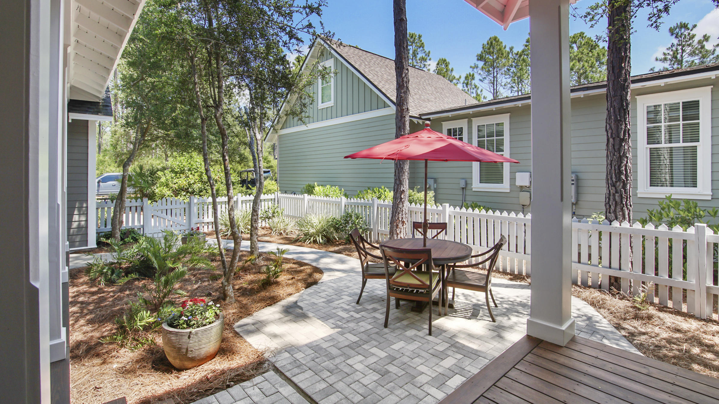 247 Artesian Way Watersound, FL 32461 - Photo 6 of 36 a patio with a patio table and chairs