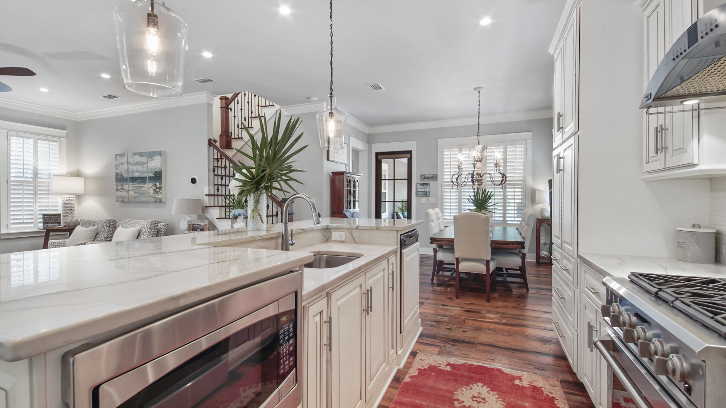 247 Artesian Way Watersound, FL 32461 - Photo 9 of 36 a kitchen with sink stove and table