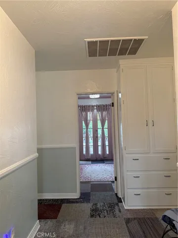a view of a hallway with closet
