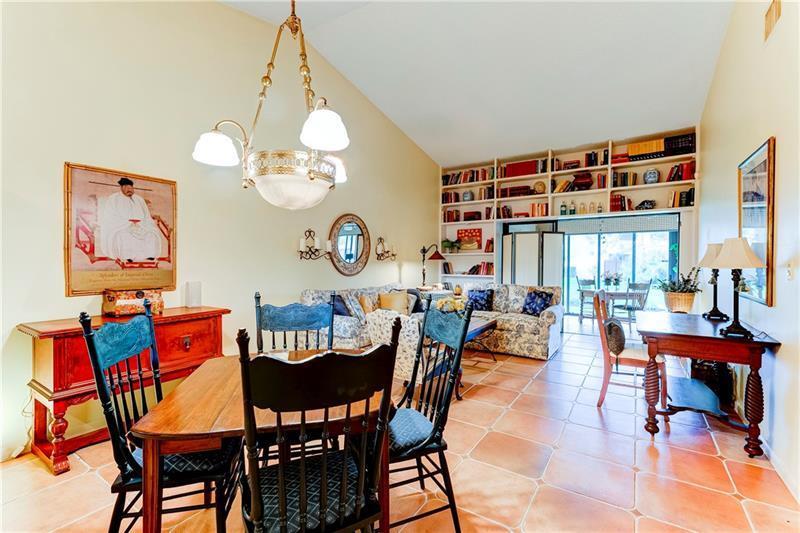3342 Carambola Circle South Coconut Creek, FL 33066 - Photo 1 of 17 a view of a dining room with furniture a chandelier and a large window