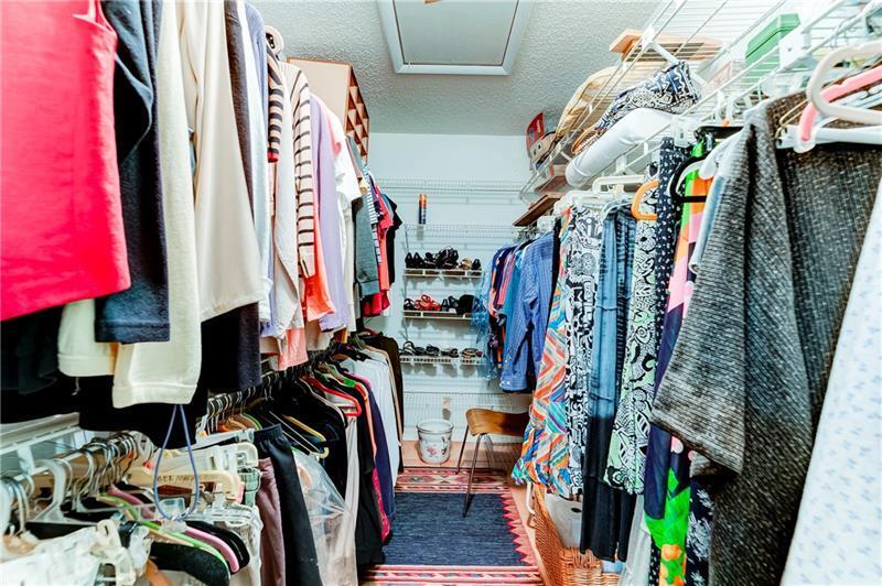 3342 Carambola Circle South Coconut Creek, FL 33066 - Photo 14 of 17 a view of walk in closet with clothes