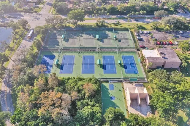 an aerial view of residential houses with outdoor space