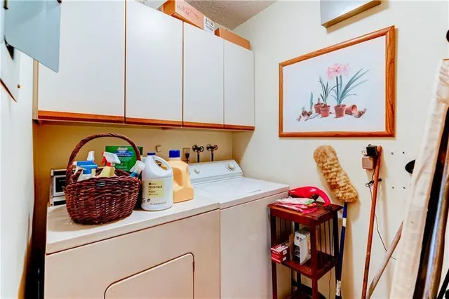a kitchen with a table and cabinets