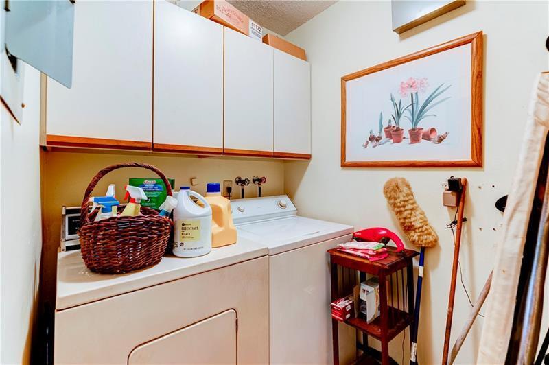 3342 Carambola Circle South Coconut Creek, FL 33066 - Photo 17 of 17 a kitchen with a table and cabinets