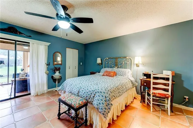 a bed room with a bed and a chandelier