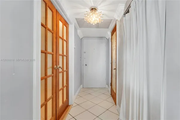 a view of entryway and chandelier fan