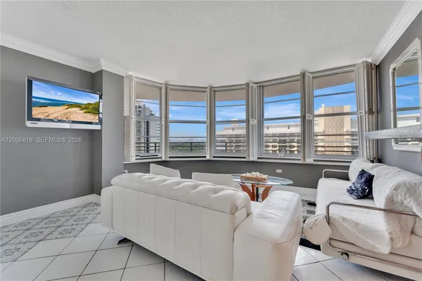 a living room with furniture and a large window