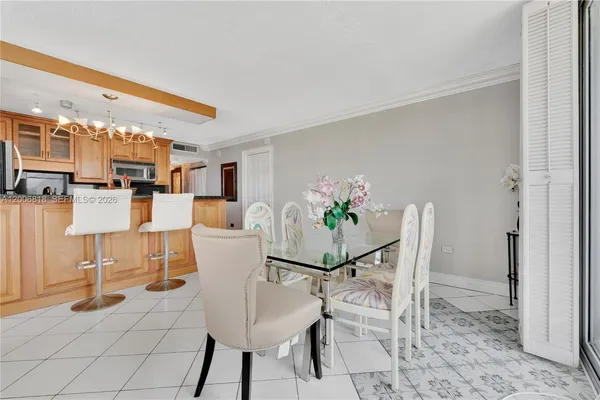 a view of a dining room with furniture and a rug