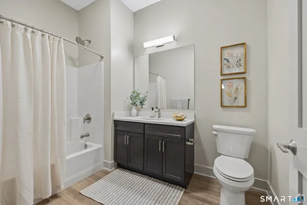 a bathroom with a toilet a sink and a bathtub