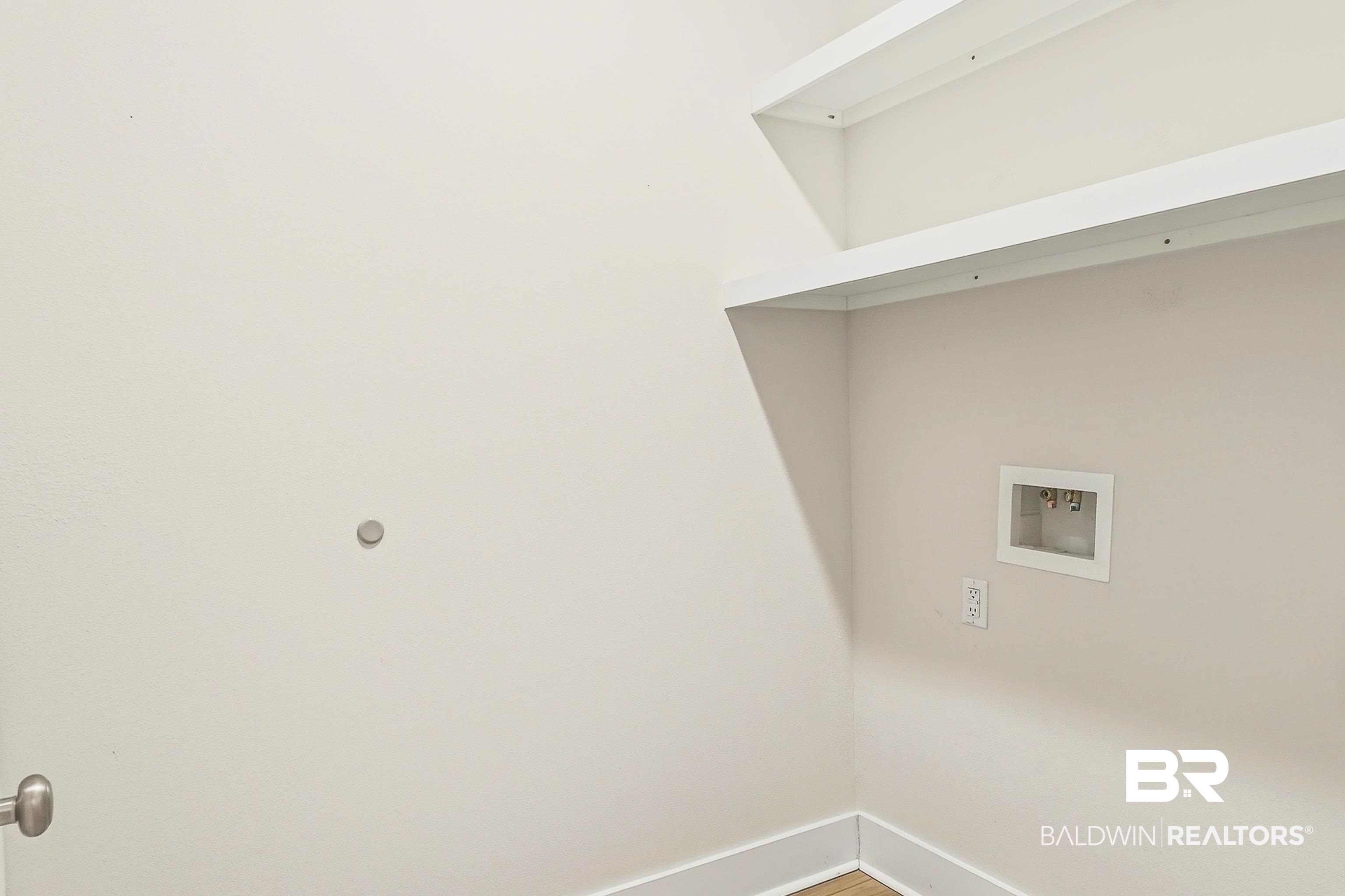 1728 Partridge Street Foley, AL 36535 - Photo 32 of 37 Laundry area with hookup for a washing machine and wood finished floors
