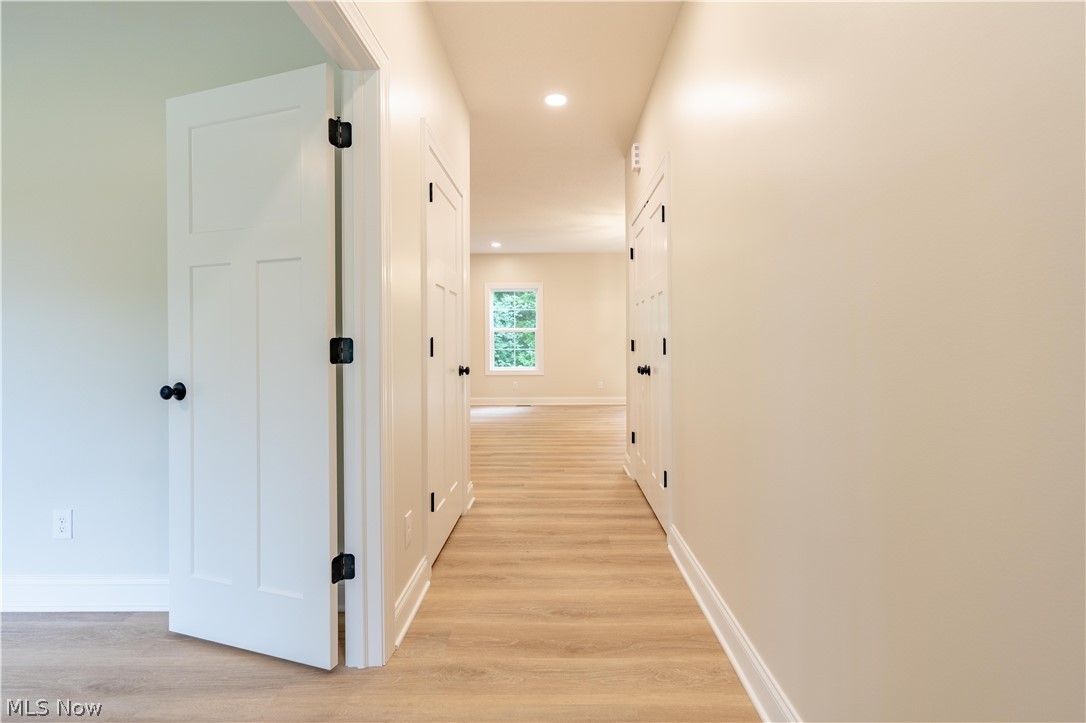7876 Burkey Road Northwest North Canton, OH 44720 - Photo 12 of 40 First floor hallway outside optional bedroom/office.