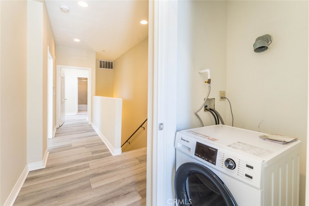 511 East Harvard Road, Unit 101 Burbank, CA 91501 - Photo 20 of 29 a view of a hallway with washer and dryer