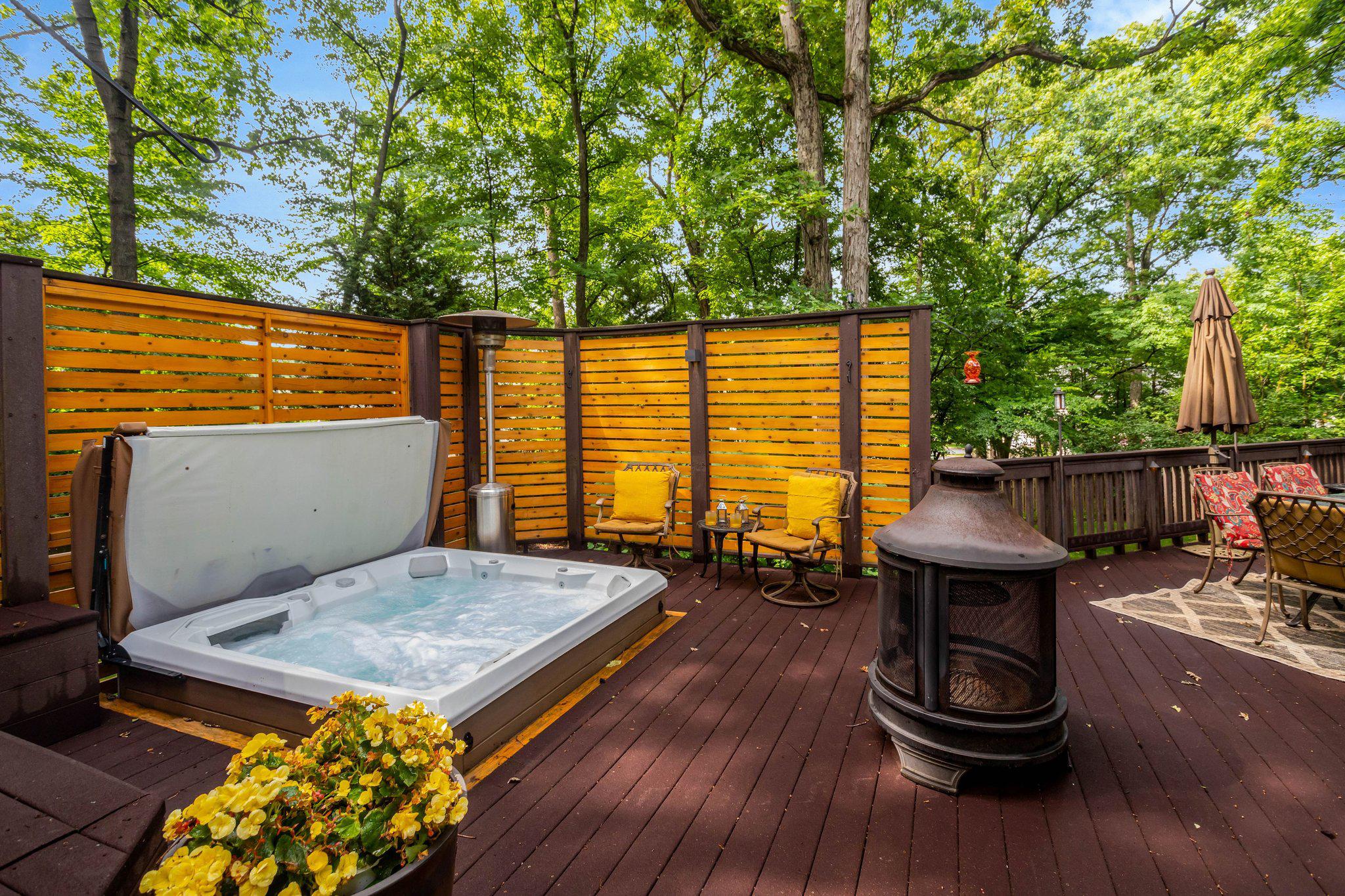 7506 Oriole Avenue Springfield, VA 22150 - Photo 52 of 67 a view of a patio with table and chairs with wooden floor and fence