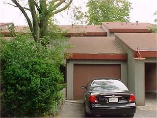 a car parked in front of a house