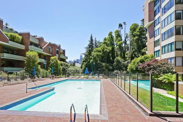 a view of a backyard with sitting area and furniture