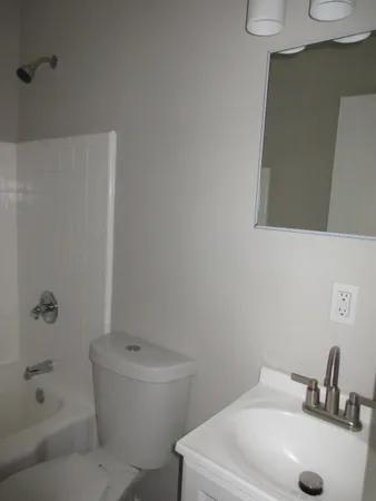 a bathroom with a sink and mirror