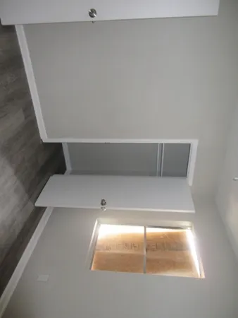 a view of an empty room and window