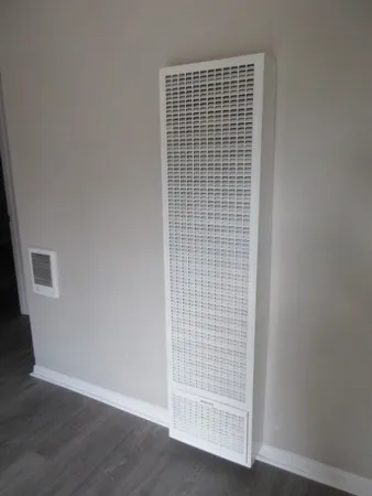 a view of wooden floor and brick walls