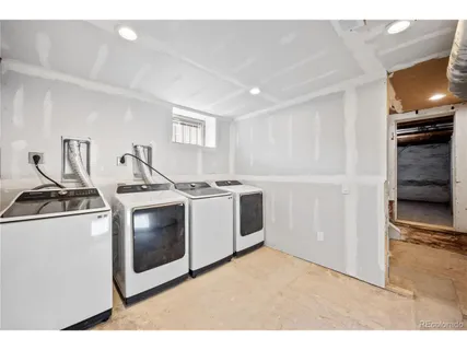 a kitchen with stainless steel appliances granite countertop a stove and a refrigerator