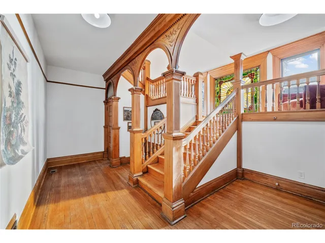 a view of an entryway with wooden floor