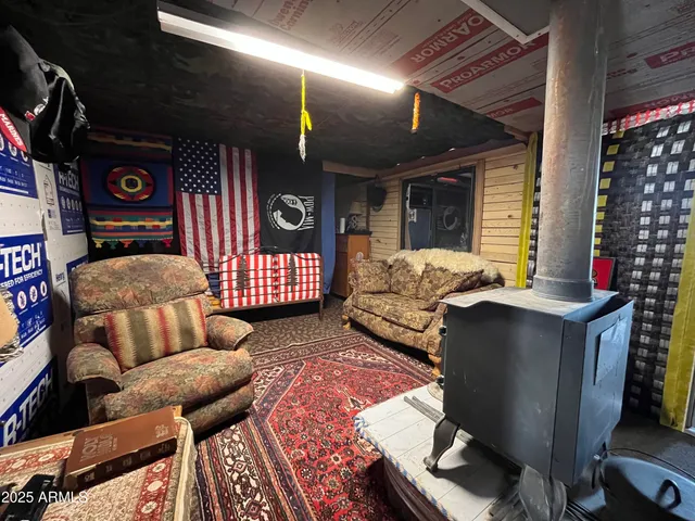 a living room with furniture a rug and a chandelier