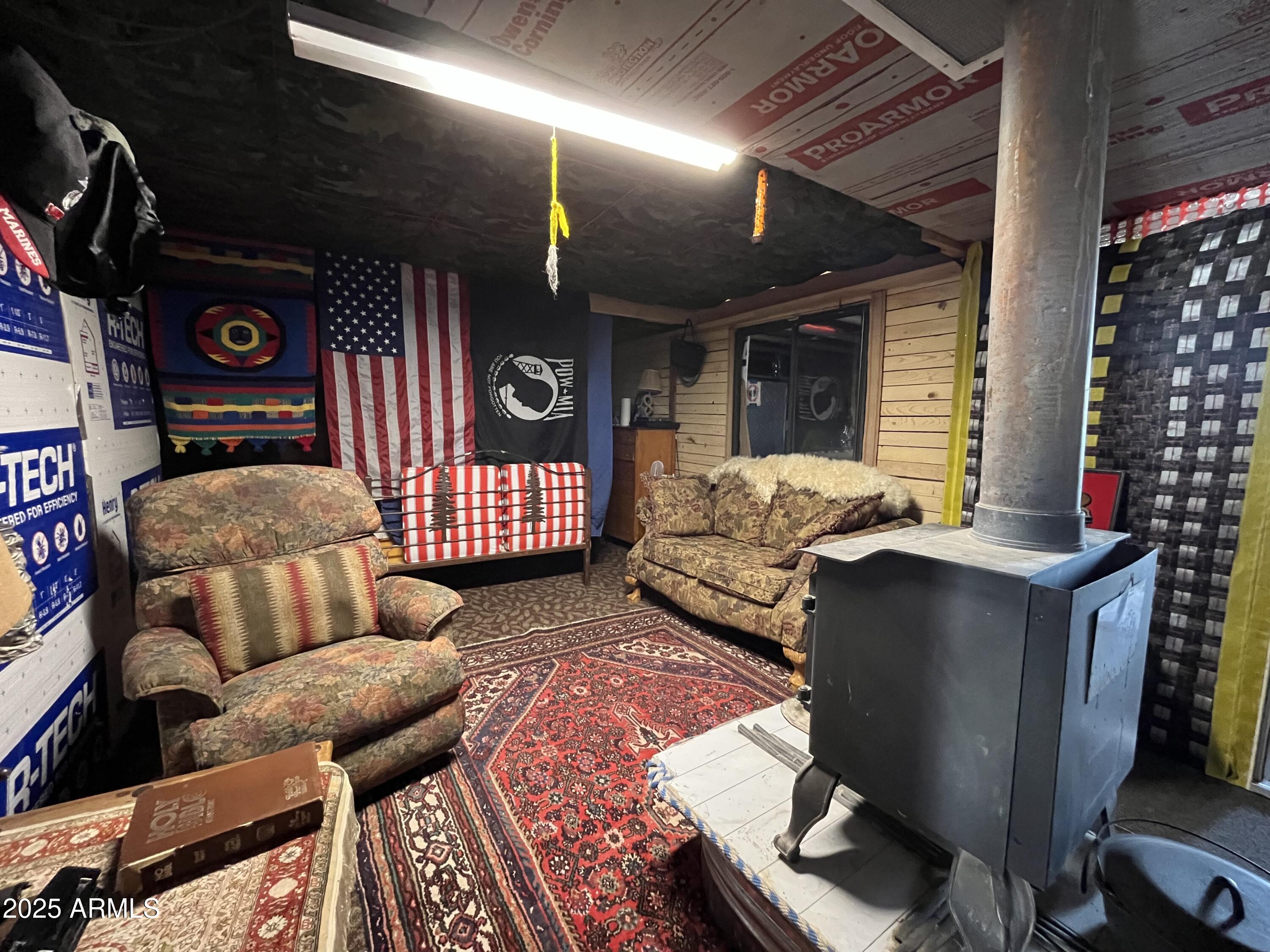 613 Mountain Cat Road, Unit 511 Williams, AZ 86046 - Photo 13 of 26 a living room with furniture a rug and a chandelier