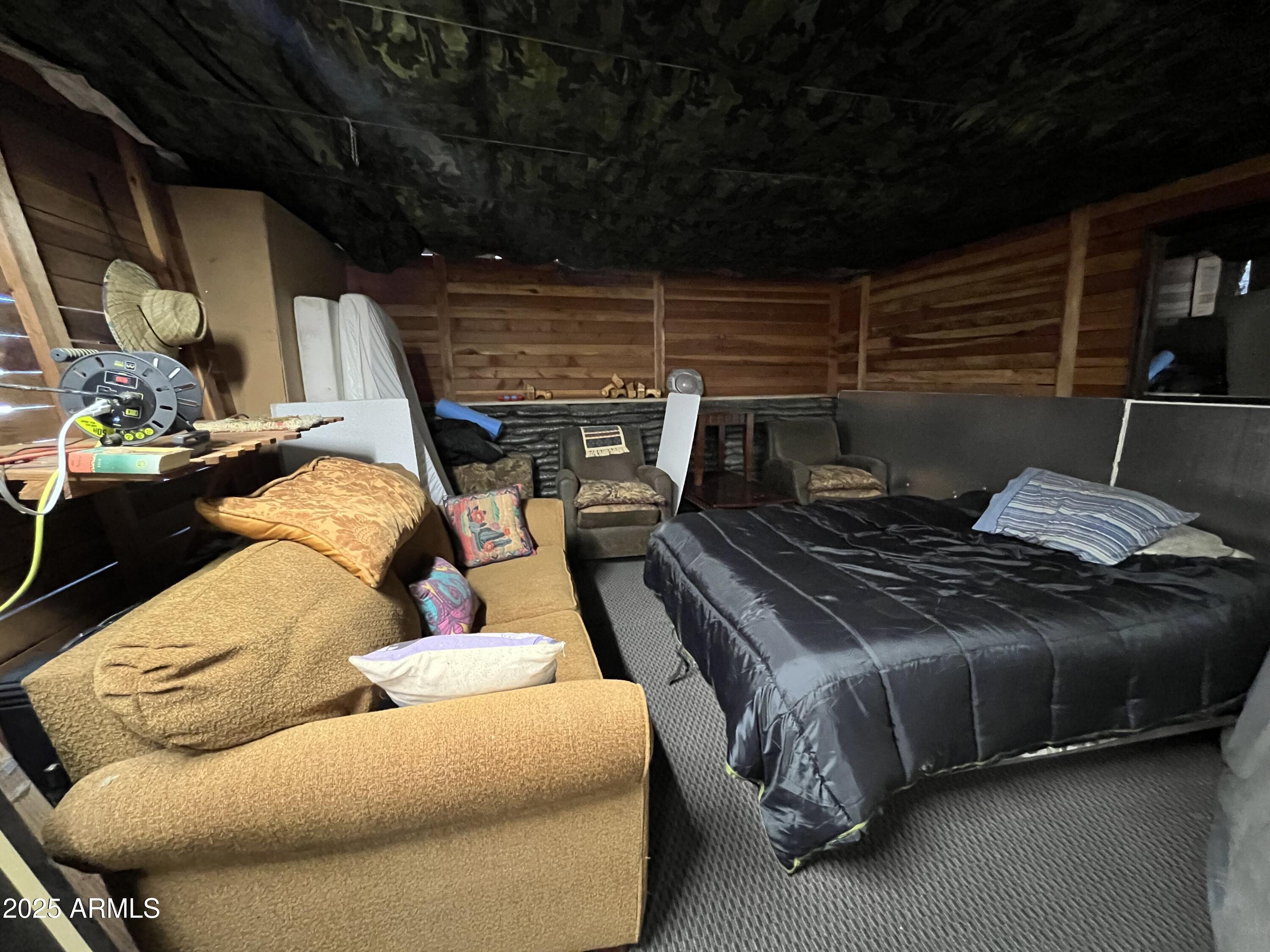 613 Mountain Cat Road, Unit 511 Williams, AZ 86046 - Photo 14 of 26 a bed sitting in a bedroom next to a window