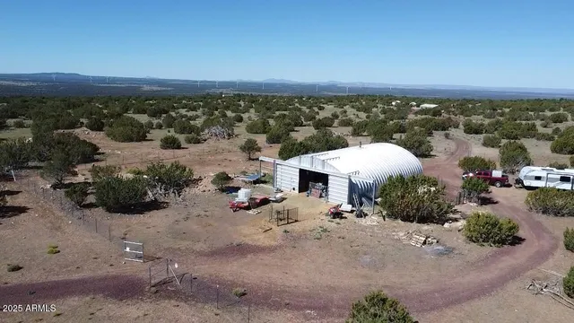 an aerial view of a house with a garden