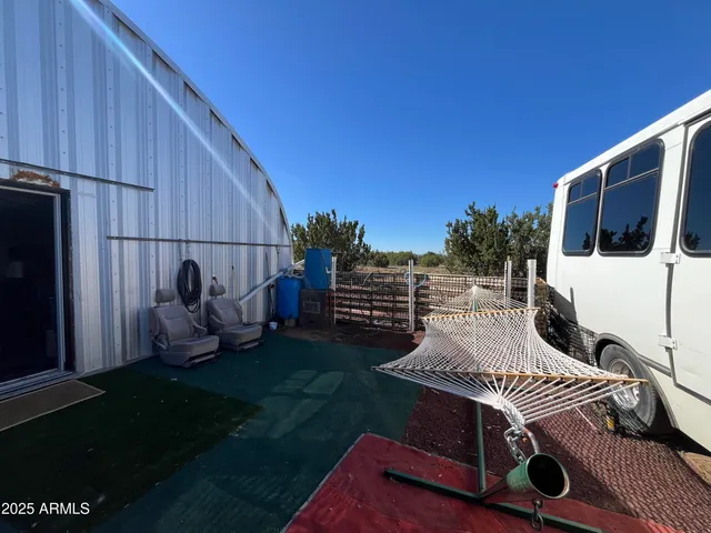 a view of a backyard with sitting area