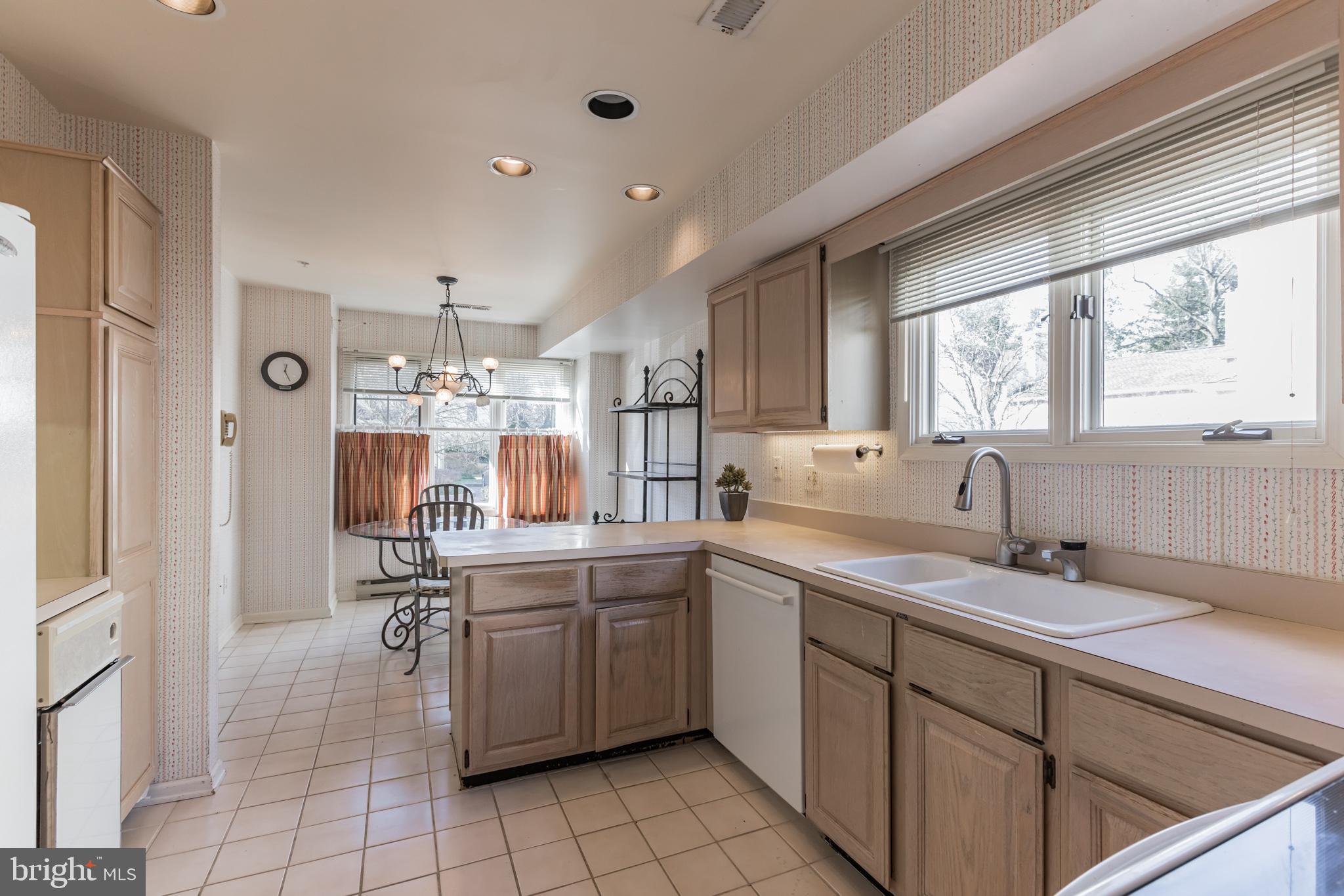 KITCHEN LOOKING INTO BREAKFAST ROOM