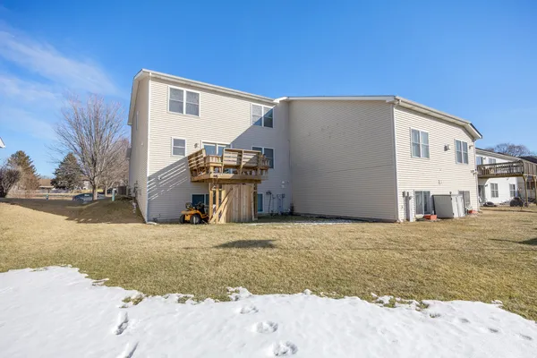 a view of a house with a snow in the background