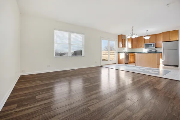 a view of a kitchen with wooden floor