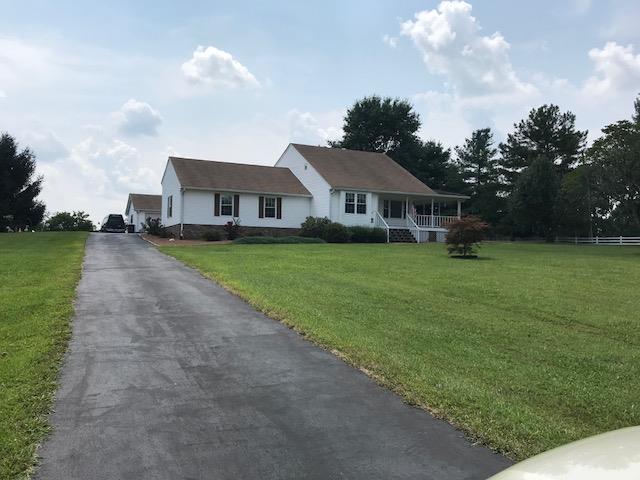 326 Denning Ford Road Portland, TN 37148 - Photo 1 of 28 a front view of a house with garden