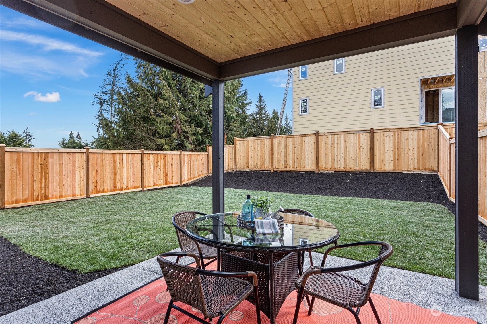 116 161st Street Southeast, Unit 2 Bothell, WA 98012 - Photo 32 of 37 a view of backyard with table and chairs and wooden fence