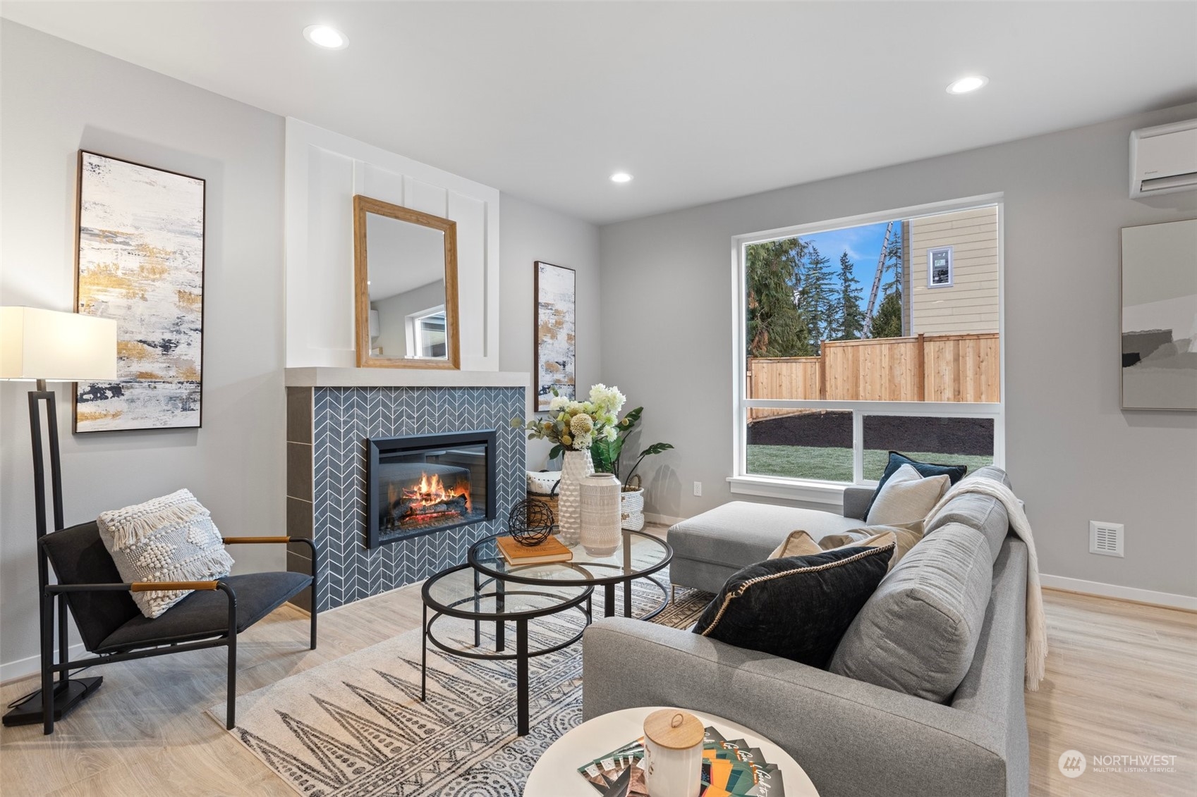 116 161st Street Southeast, Unit 2 Bothell, WA 98012 - Photo 5 of 37 a living room with furniture and a fireplace