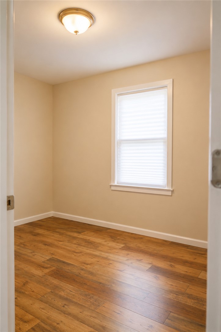 605 Hampton Street Iva, SC 29655 - Photo 12 of 16 Natural light filters into this quiet room with beautiful wood flooring.
