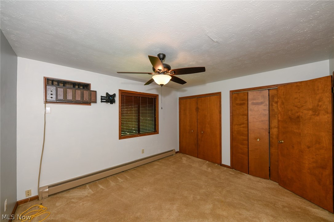 2715 Graham Road, Unit 4 Stow, OH 44224 - Photo 25 of 35 2715 Graham Rd #4, Stow, OH 44224 is an end unit condominium with 2 bedrooms, 1.5 bathrooms, 1 car garage, finished basement, laundry in lower level, huge side yard with pet fence & 3 collars provided, open floor plan from galley kitchen with oak cabinets & appliances to the large living room with wood burning fireplace, sliding glass doors to rear deck and sitting porch up front.