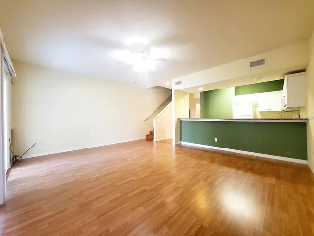 a view of a kitchen with a sink and a window