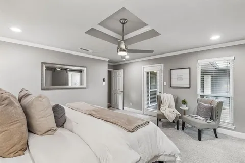 a bedroom with furniture and a chandelier