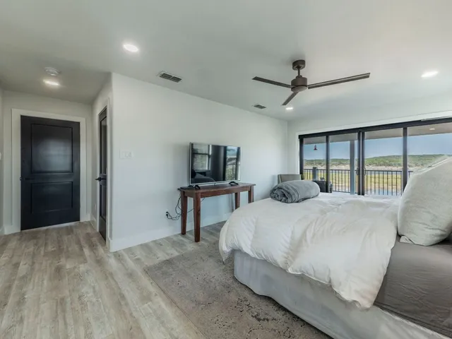 a view of a lake with houses in the back