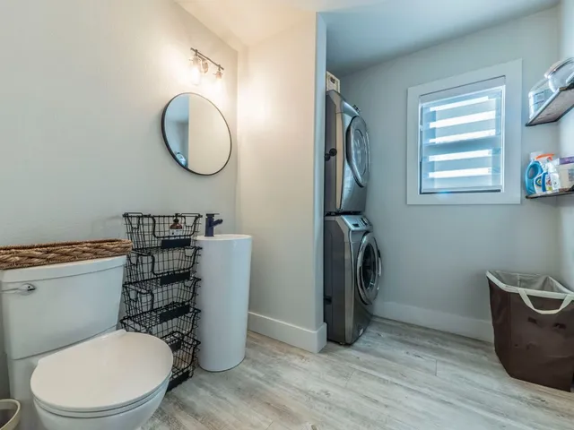 a bathroom with double vanity sink and a mirror