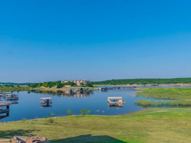 a bedroom with a large bed and a tv