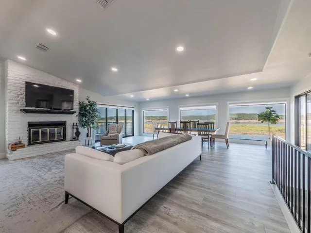 a living room with fireplace furniture and a flat screen tv