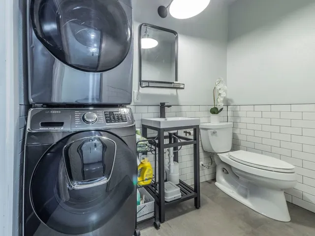 a spacious bedroom with a large bed and a large window