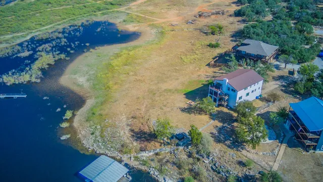 an aerial view of residential houses with outdoor space