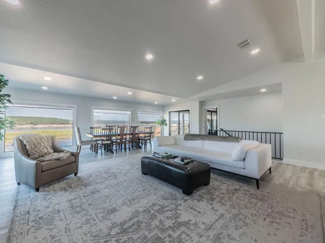 a living room with furniture and a table