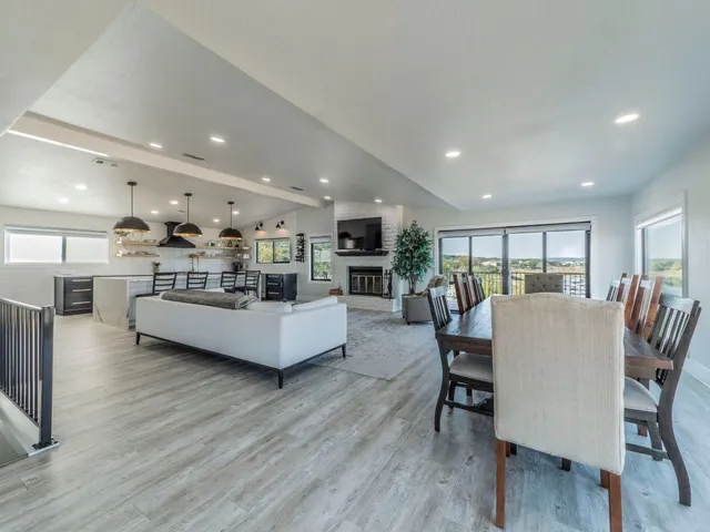 a view of a dining room with furniture wooden floor and chandelier